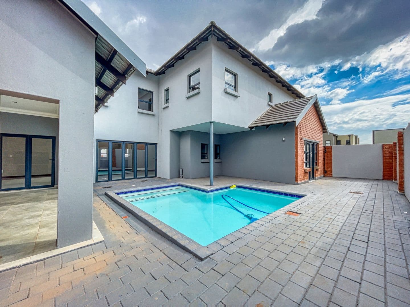 Modern home with a pool and open outdoor living space